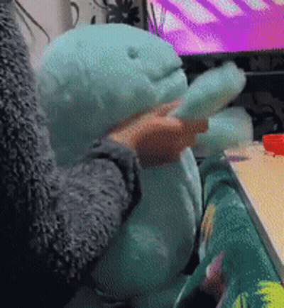 Cartoon Dinosaur Running Through Grassy Field Holding Ball GIF