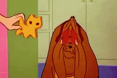 Cartoon Dog Being Fed Cheese GIF