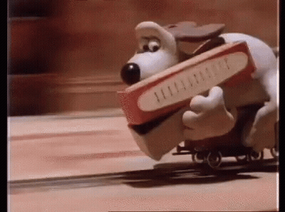 Cartoon Dog Carrying Box On Train GIF