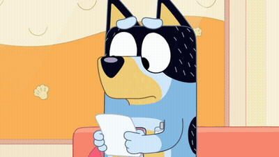 Cartoon Dog Holding Paper On Couch GIF