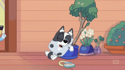 Cartoon Dog Laying Next To Potted Plant And Purse GIF