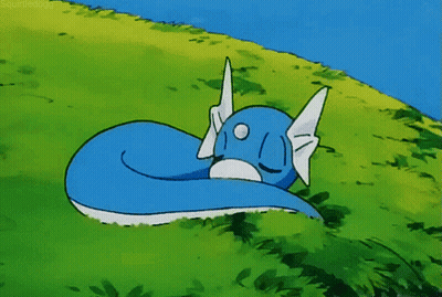 Cartoon Dragon With Wings Standing On Sidewalk GIF