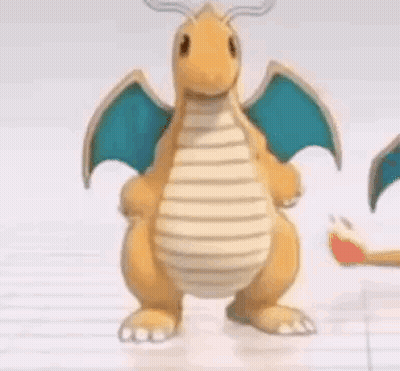 Cartoon Dragon With Wings Standing On Table GIF