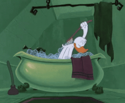 Cartoon Duck Bathing In Green Bathtub Holding Toothbrush GIF