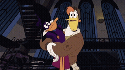 Cartoon Duck Holding Duck With Letter T GIF