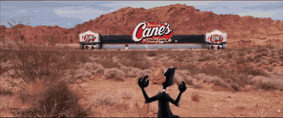 Cartoon Duck In Front Of Canes Sign GIF