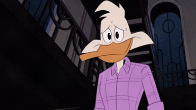 Cartoon Duck In Purple Shirt Standing In Front Of Building GIF