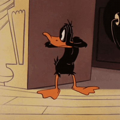Cartoon Duck Standing In Front Of Wall GIF
