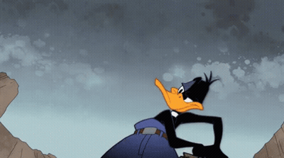 Cartoon Duck Standing On Rocky Cliff GIF