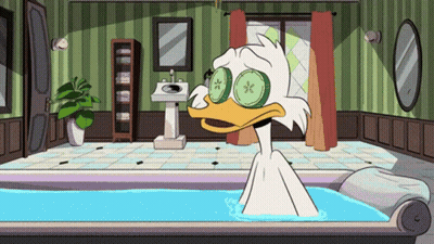 Cartoon Duck With Cucumber Slices Taking A Bath GIF