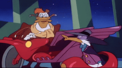 Cartoon Ducks Sitting In Red Car GIF