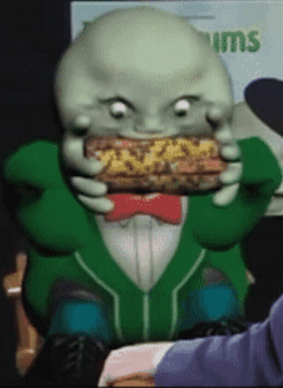 Cartoon Eating Sandwich With Tums Sign GIF