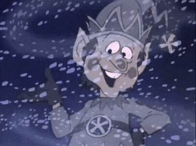 Cartoon Elf Standing In Snow With Star On Chest GIF