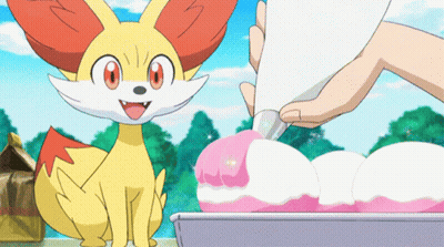 Cartoon Fox Sitting Next To Person Piping Pink Frosting On Cake GIF