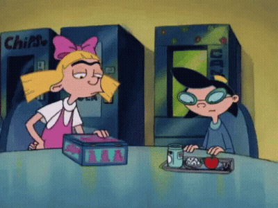 Cartoon Girl And Boy Sitting At Table GIF