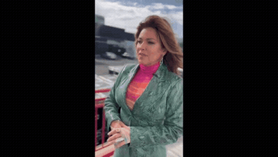 Cartoon Girl Holding Purple Object In Front Of Ray Williams Poster GIF