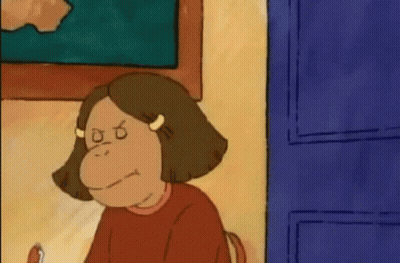 Cartoon Girl With Monkey Face Sitting At Table GIF