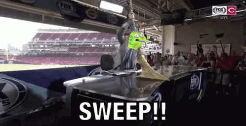 Cartoon Green Monster Sweeping Table In Front Of Crowd GIF