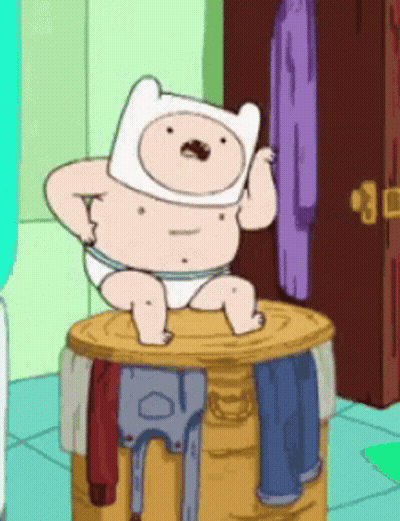 Cartoon In Diaper Sitting On Barrel Of Clothes GIF