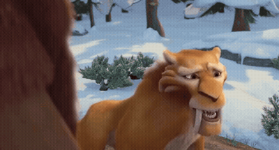 Cartoon Lion Standing In Snow Looking At Another Lion GIF