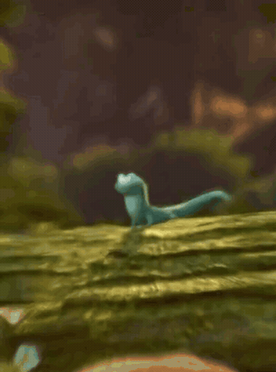 Cartoon Lizard Standing On Mossy Hill GIF