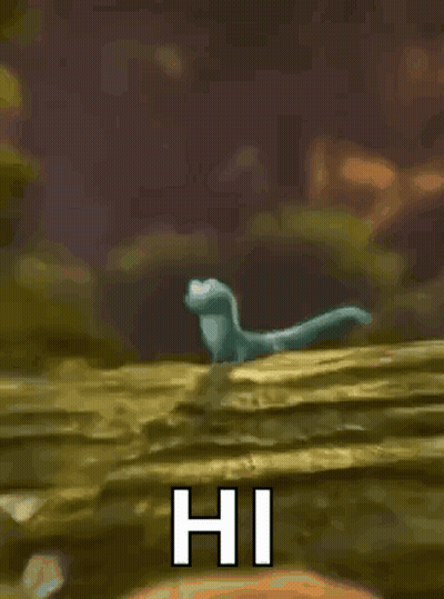 Cartoon Lizard Standing On Rock Waving GIF