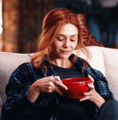 Cartoon Man Eating Cereal With Cereal Pile GIF
