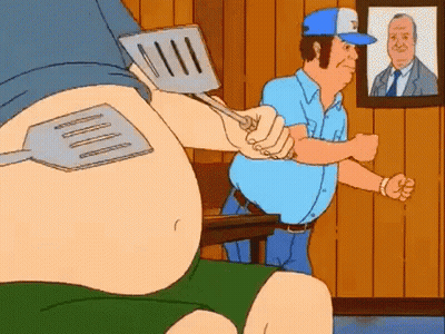 Cartoon Man Holding Spatula Over Another Man's Stomach GIF