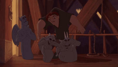 Cartoon Man Standing Next To Gargoyle Statue GIF