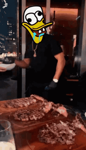Cartoon Man With Duck On Face In Front Of Cutting Board Of Meat GIF