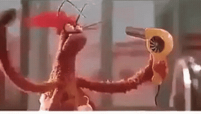 Cartoon Monster Holding Hair Dryer In Mouth GIF