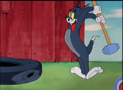 Cartoon Mouse Sitting On Bed Nibbles GIF