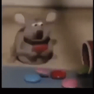 Cartoon Mouse With Red Heart Sitting On Table GIF