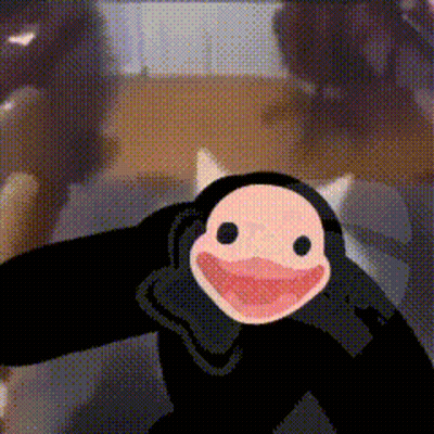 Cartoon Penguin Smiling In Front Of Person GIF