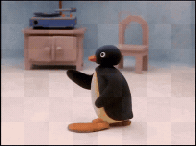 Cartoon Penguin Standing By Record Player GIF