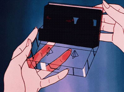 Cartoon Person Holding Cassette Tape Saying A GIF