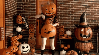 Cartoon Pumpkin Head Holding Pumpkin Spice Coffee GIF