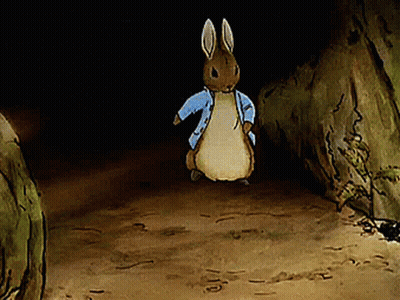 Cartoon Rabbit In Blue Jacket Standing In Cave GIF
