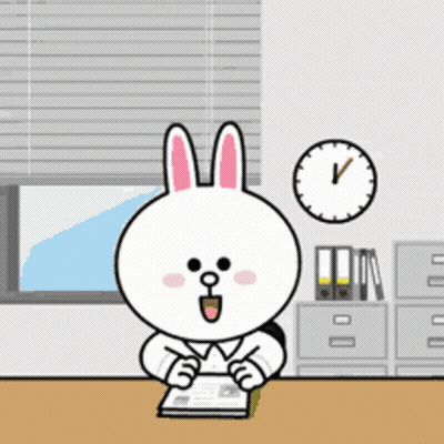 Cartoon Rabbit Sitting At Desk With Book And Clock GIF