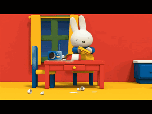 Cartoon Rabbit Sitting At Table GIF