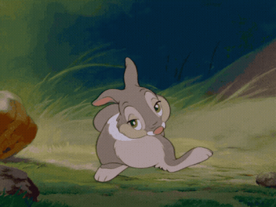 Cartoon Rabbit Standing In Grass With Eyes Closed GIF