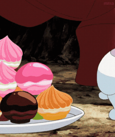 Cartoon Rabbit Standing Next To Plate Of Desserts GIF