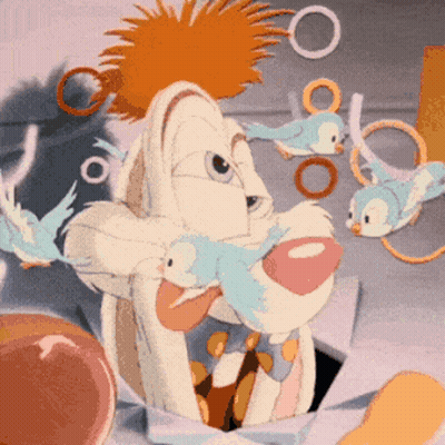Cartoon Rabbit With Birds Flying Around GIF