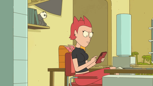 Cartoon Red-Haired Character Sitting At Desk GIF