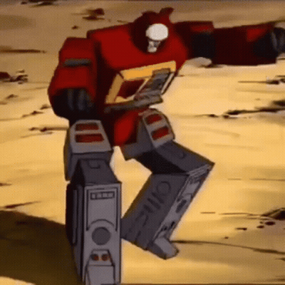 Cartoon Robot Dancing In Desert Holding Computer Case GIF