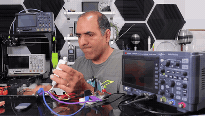 Cartoon Robot Standing In Front Of City GIF