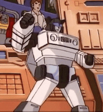 Cartoon Robot Standing In Front Of Control Panel GIF