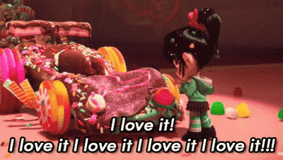 Cartoon Saying I Love It Next To Car Covered In Candy GIF