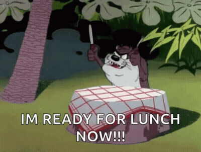 Cartoon Sitting At Table Holding Knife Saying Im Ready For Lunch Now GIF