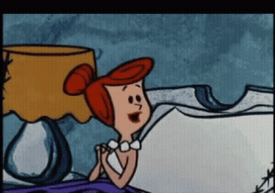 Cartoon Sitting On Bed With Lamp GIF